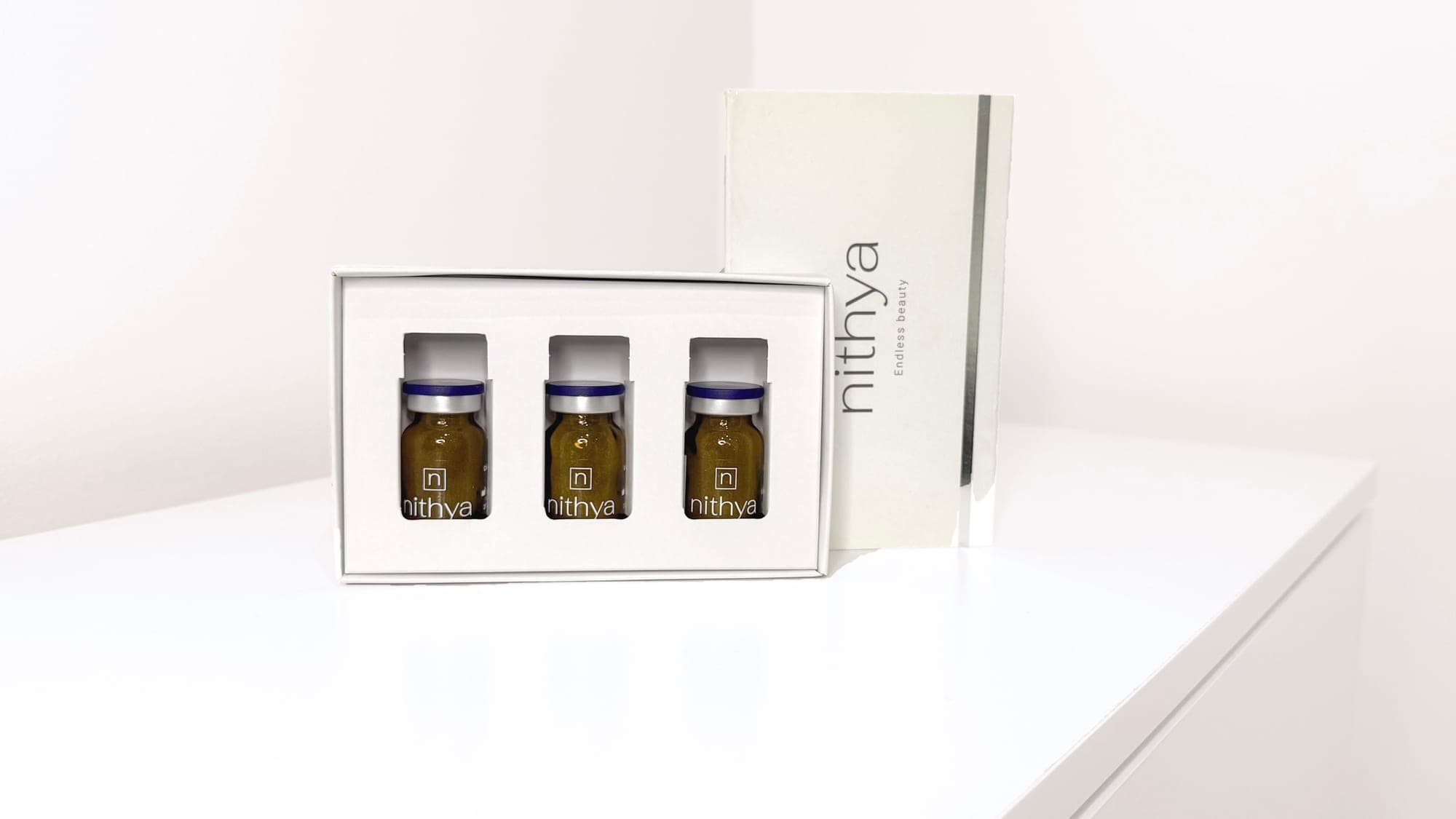 Nithya packaging and injectable collagen vials.