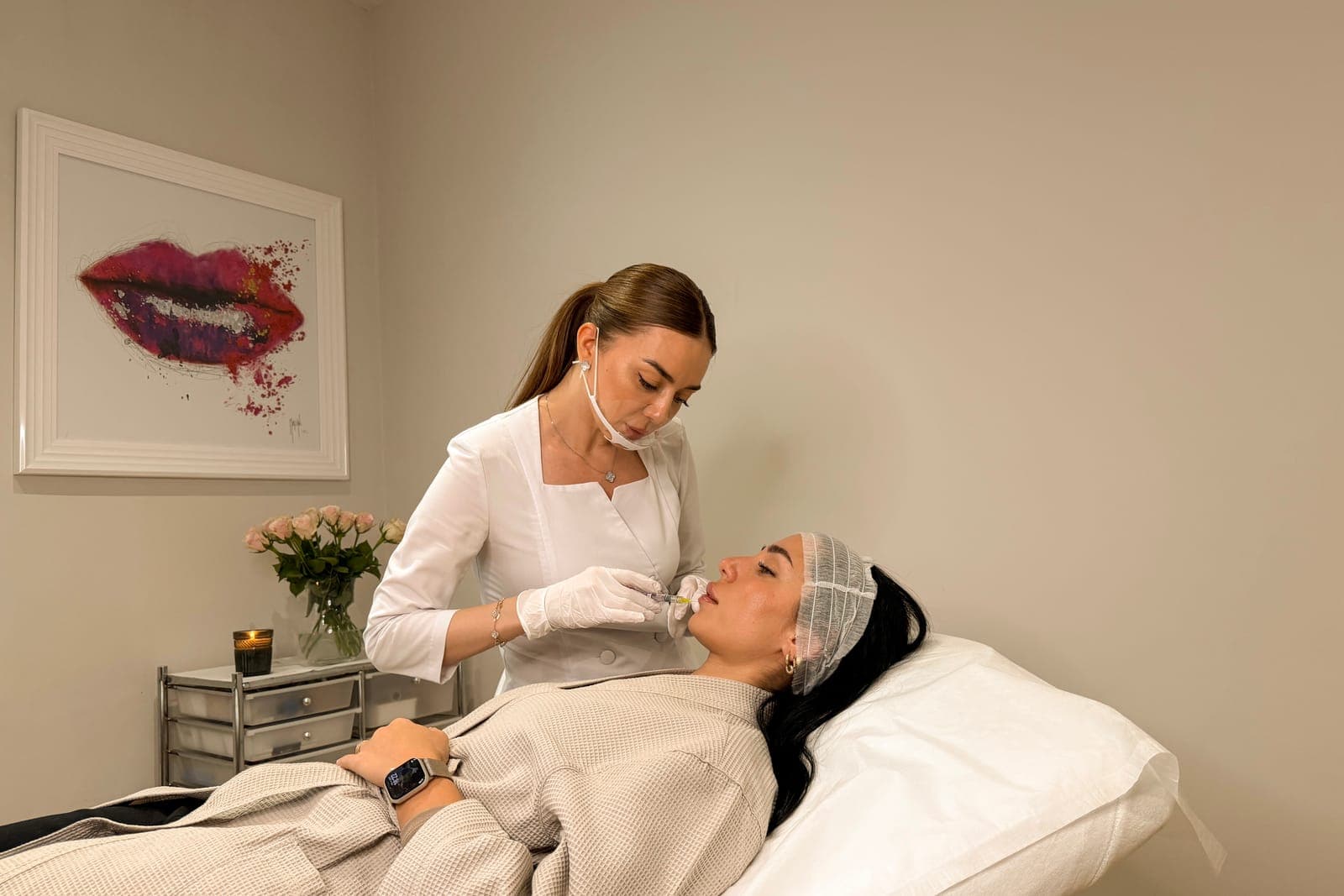 Practitioner carrying out a lip filler treatment in the treatment room at ART FACE Clinic, Pimlico, London