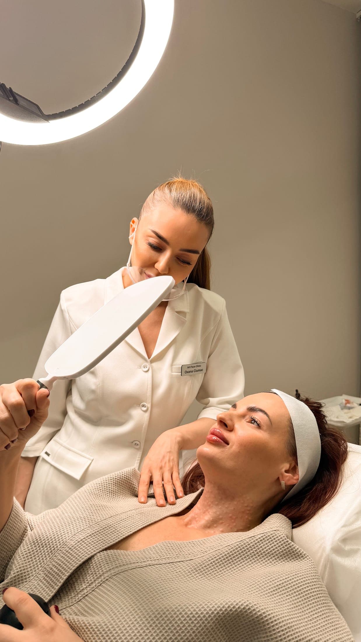 Oxana and a client discussing her skin at ART FACE London.