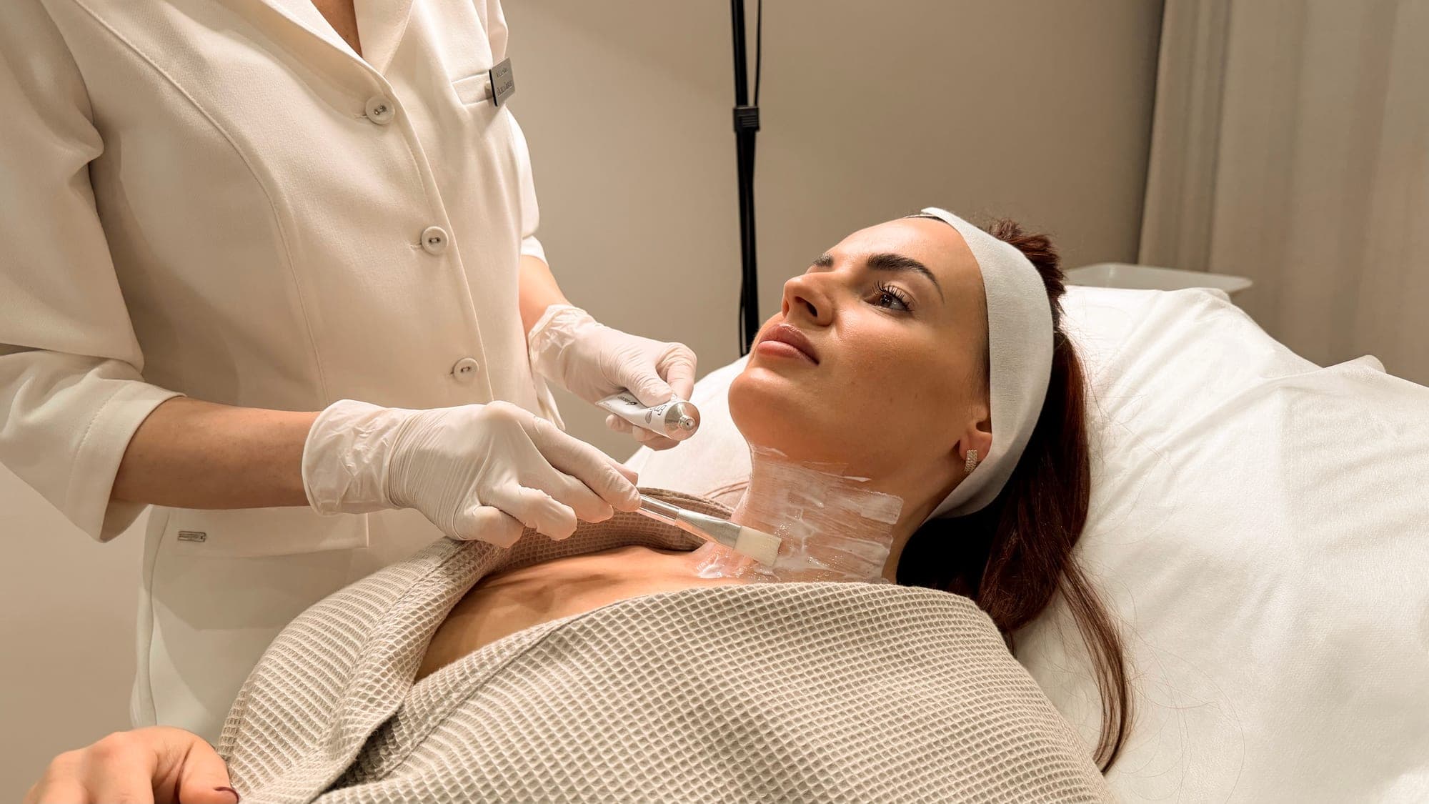 Preparing the client’s neck for mesotherapy.
