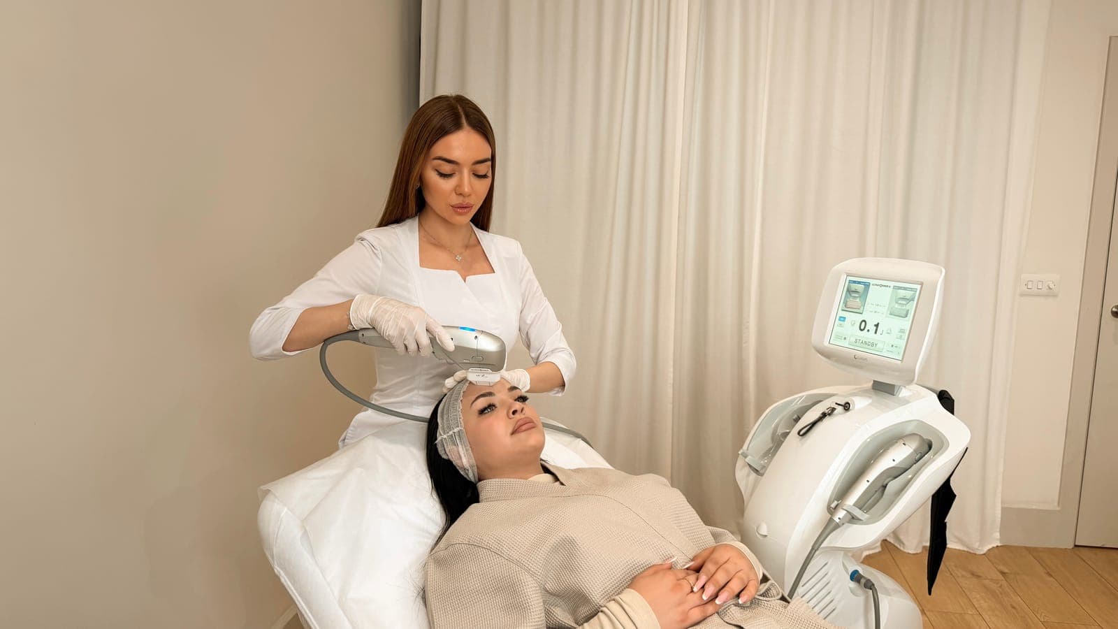 Ultraformer III treatment in progress at ART FACE London, with the Ultraformer machine beside the treatment bed