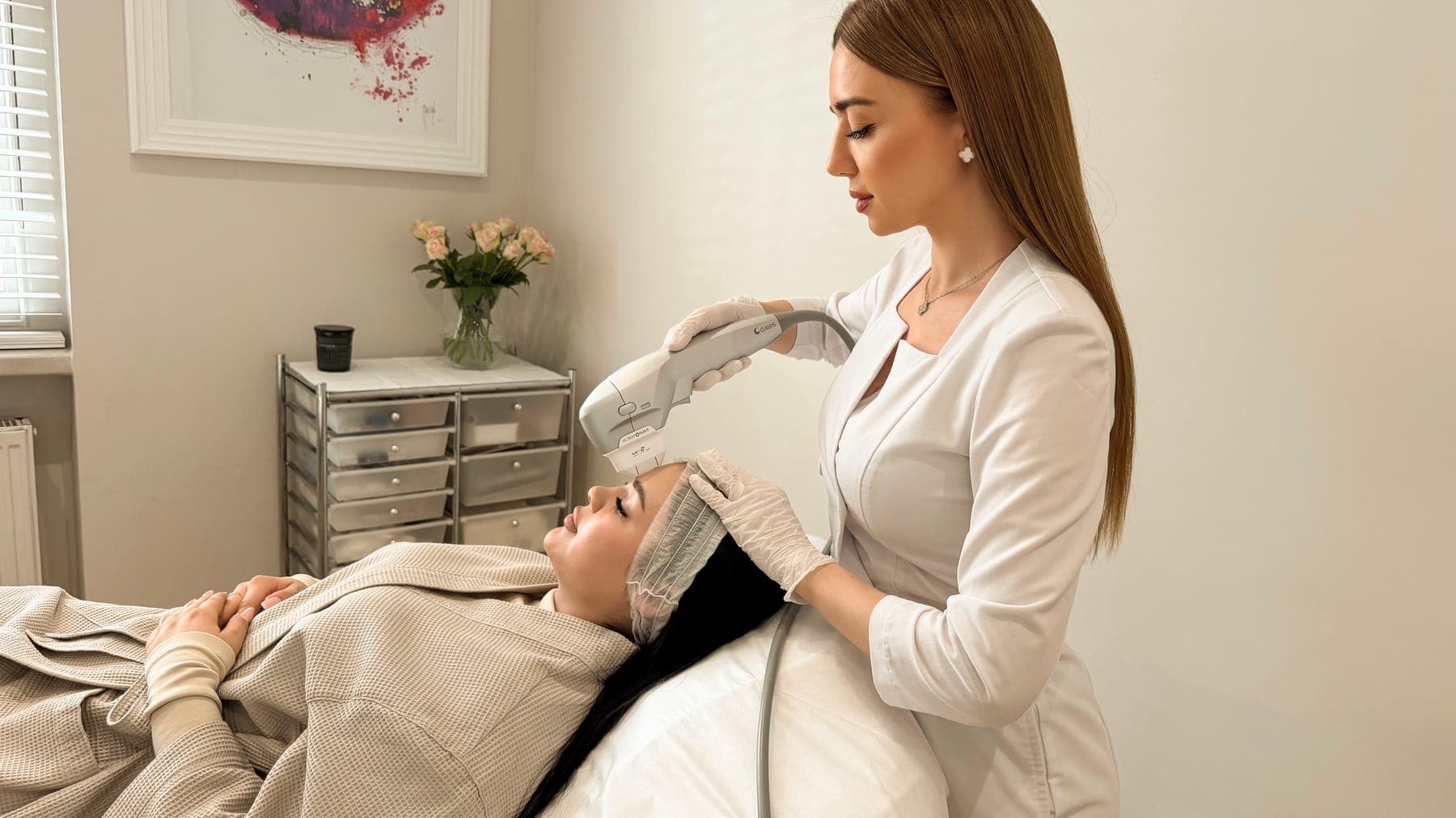 Practitioner carrying out an Ultraformer III HIFU treatment on a client's face at ART FACE London, Pimlico